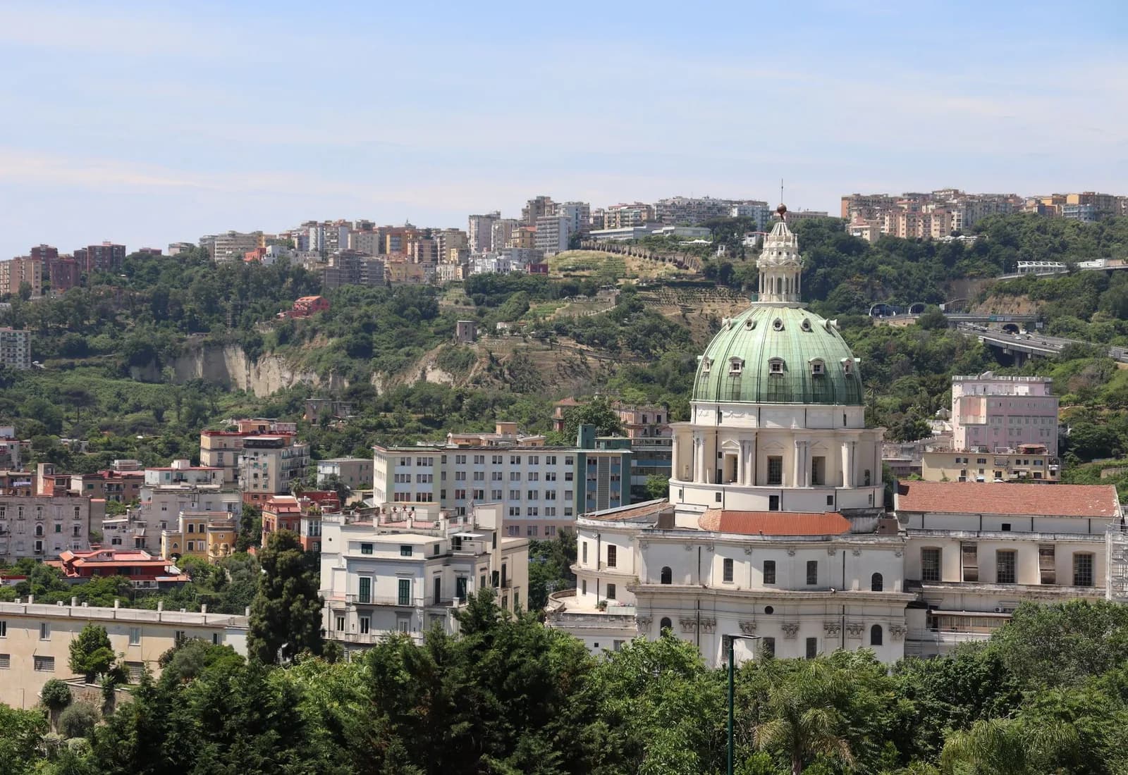 Explore the stunning urban skyline of Naples with the iconic Capodimonte church.